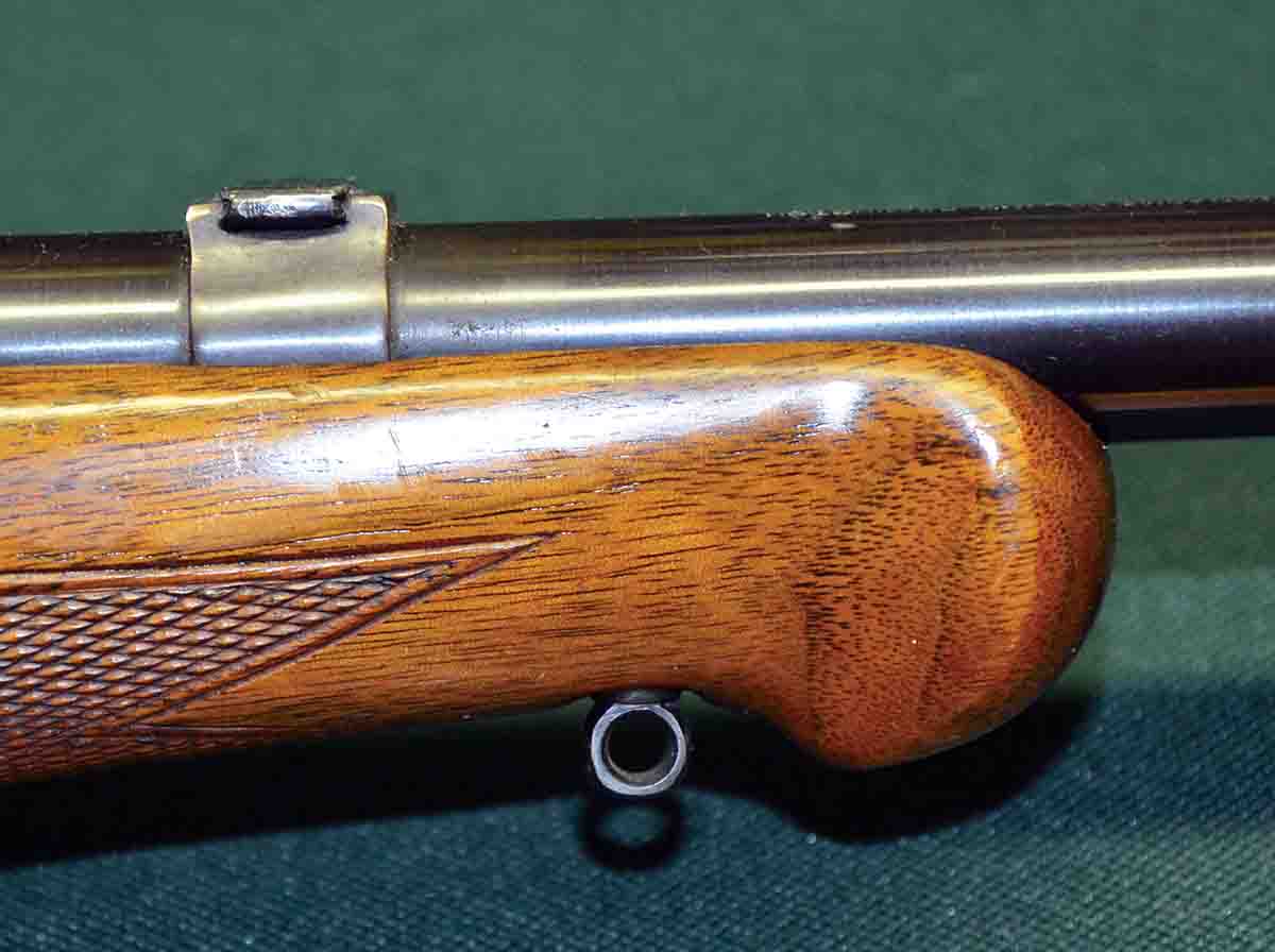 The ends of carry slings had a steel hook that engaged an eye in the stock. A second eye is in the buttstock. When a receiver sight was installed at the factory, a steel blank was used to fill the dovetail in the barrel band, which was there for an elevator-adjustable open sight.